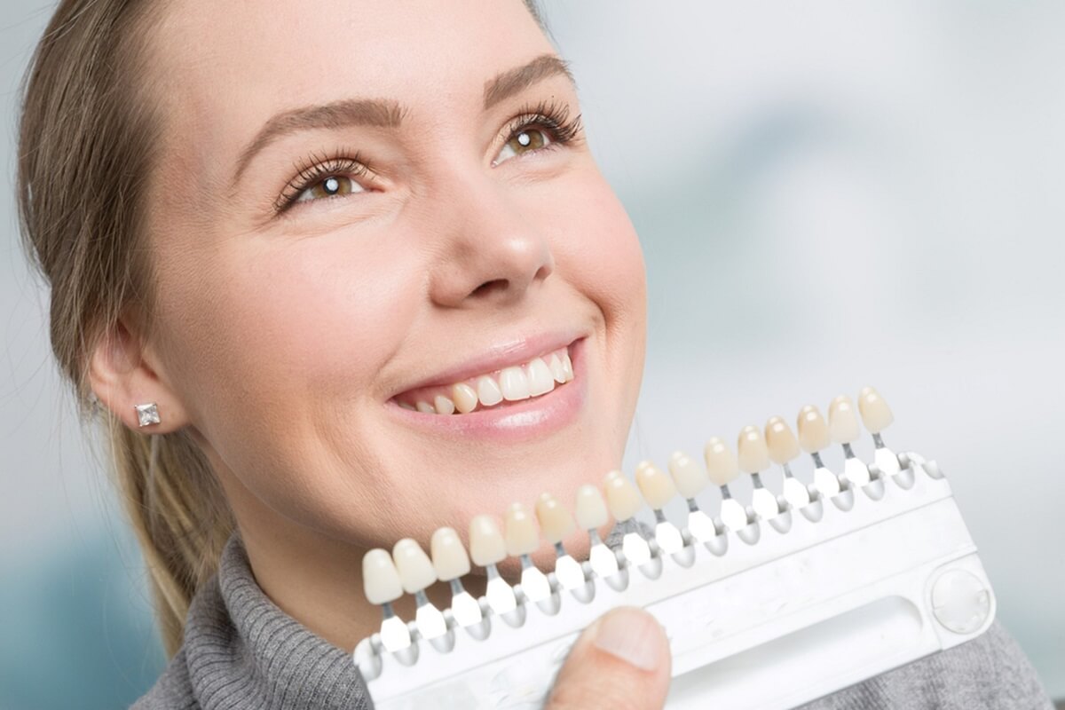 women smiling with venners in hand
